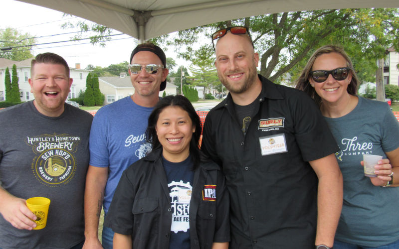 Picture of 5 Vendors and Volunteers, 2 women and 3 men, from previous Woodstock Ale Fest